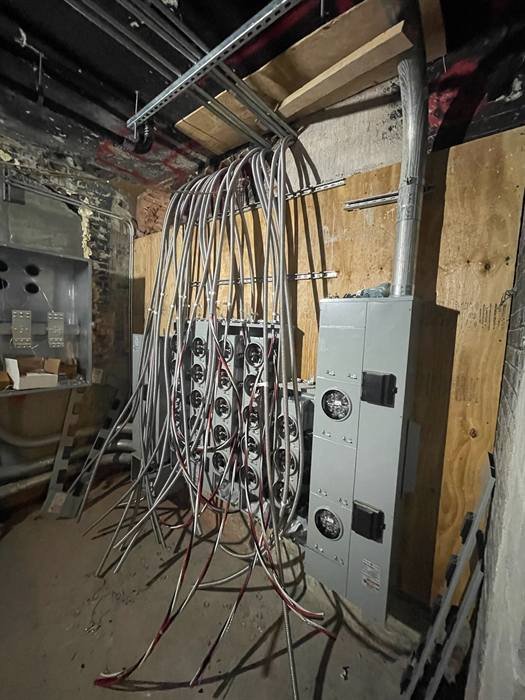Conduit runs and panel enclosures roughed in before finish work