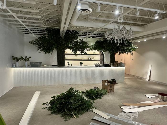 Finished commercial venue with decorative chandeliers and accent lighting