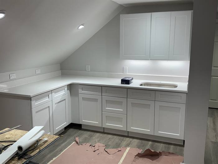 Kitchen with recessed lighting, under-cabinet lighting, and finished outlets